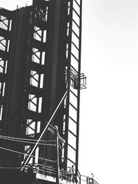 Low angle view of staircase against building against clear sky