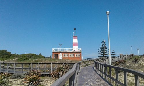 View of lighthouse against clear blue sky