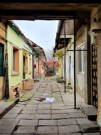 Alley amidst houses in town