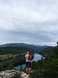 Scenic view of mountains against cloudy sky