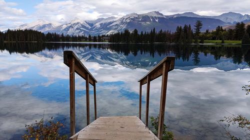 Scenic view of lake and mountains against sky