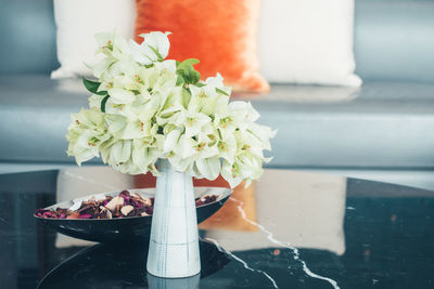 Close-up of white flower vase on table