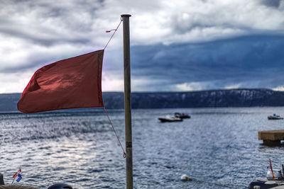 Red warning flag for severe weather on cres island