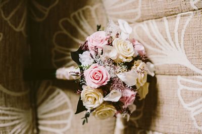 Close-up of rose bouquet on sofa