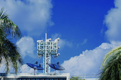 Low angle view of communications tower against sky