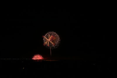 Firework display at night