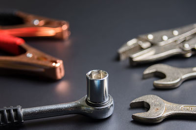 Close-up of work tools on black background