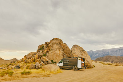 Camper van parked near boulders in northern california.