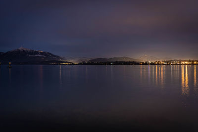 Scenic view of sea against sky at night lake of zug with rigi and pilatus 