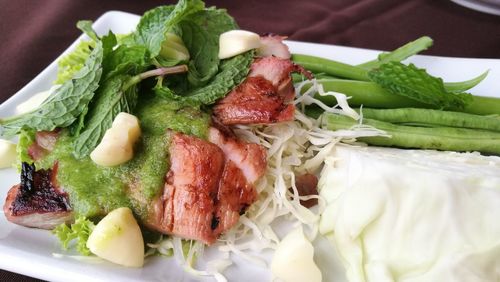 Grilled pork and salad in plate