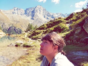 Woman in mountains against sky