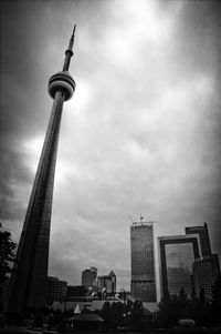 Low angle view of building against cloudy sky