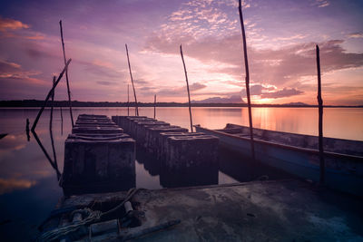 Scenic view of sea against dramatic sky during sunset