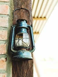 Low angle view of lantern on wall