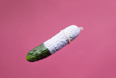 Close-up of bread against pink background