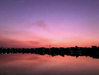 Scenic view of lake against romantic sky at sunset