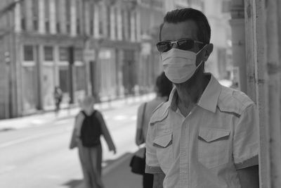 Portrait of man wearing sunglasses standing on street