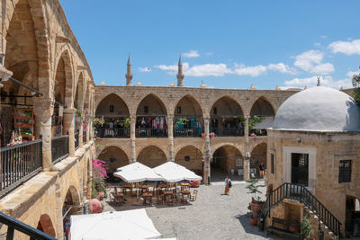 Tourists visiting kumarcilar inn in nicosia an ex caravanserai realized in 1700 