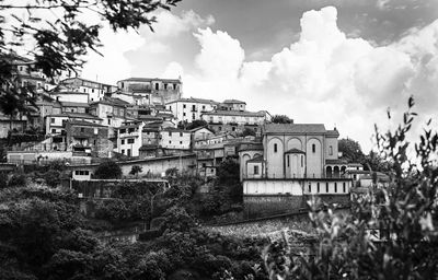 Old building in city against sky