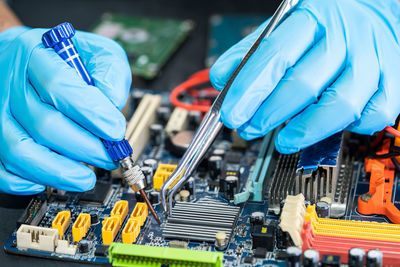 Midsection of man working in factory