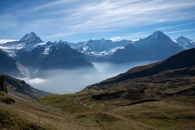 Scenic view of snowcapped mountains against sky