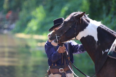 Close-up of man with horse