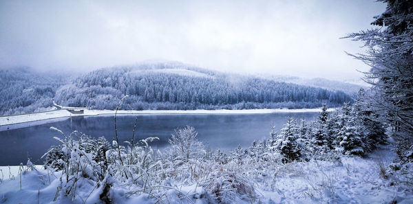 Scenic view of frozen lake against sky