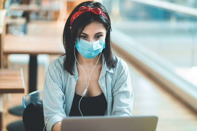 Young woman using laptop