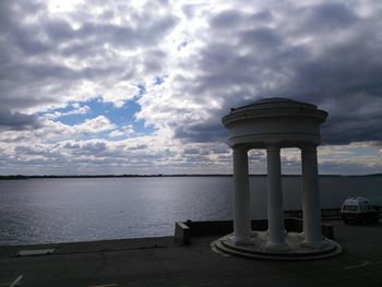 Gazebo in sea against sky