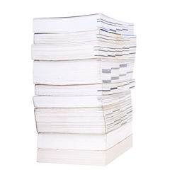 Stack of books against white background