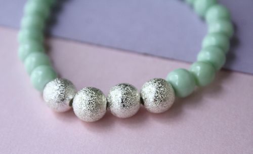 Close-up of balls on table against white background