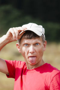 Portrait of mature man with cap outdoors