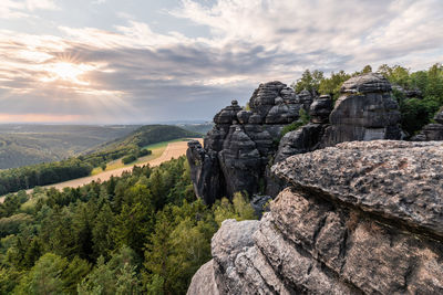 Elbe sandstone mountains - view with rocks and wide landscape in the back light