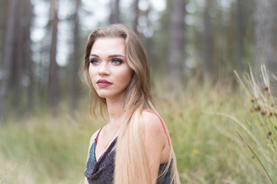 Woman with long hair looking away