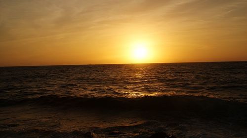 Scenic view of sea at sunset