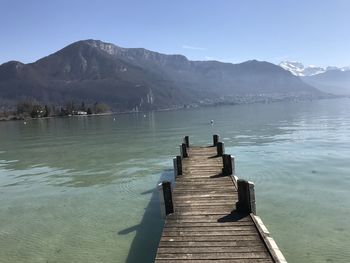 Pier over lake against sky