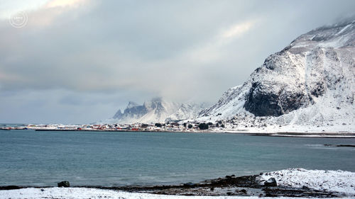 Seaside near svolvær, lofoten islands, sea and snow around mountains 