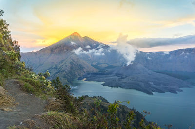 Scenic view of mountains against sky during sunset