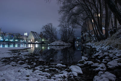 Scenic view of river against sky during winter