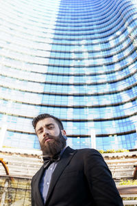 Young businessman in a glass skyscraper