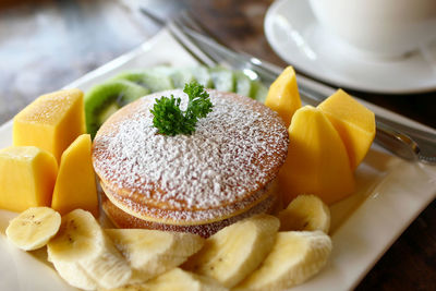 Close-up of breakfast served on table