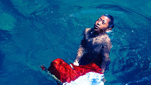 Woman relaxing in sea