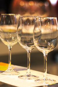 Close-up of empty wineglasses on table