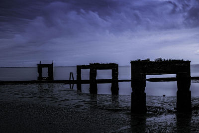 Pier over sea against sky