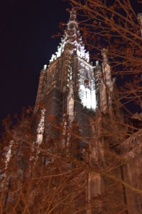 Low angle view of illuminated building during winter