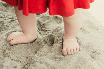 Feet of a baby on the beach