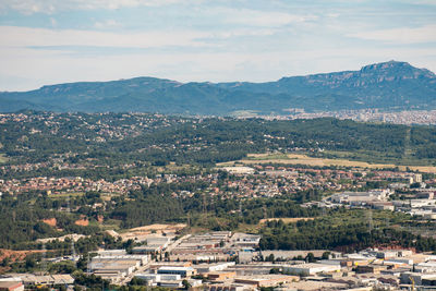 Aerial view of townscape against sky