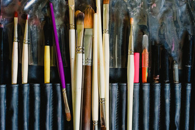 Close-up of make-up brushes on table