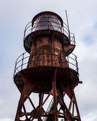 Low angle view of water tower against sky