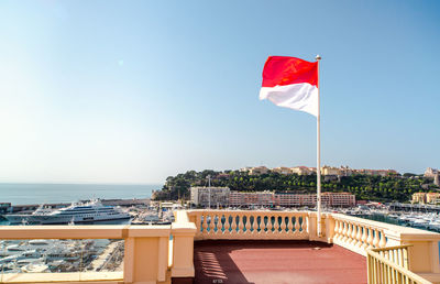 Flag on balcony against clear sky